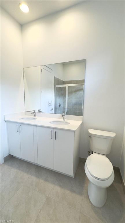 5105 Penella Ave Ave Avenue Immokalee, FL 34142 - Photo 5 of 37 a bathroom with a toilet a sink and mirror