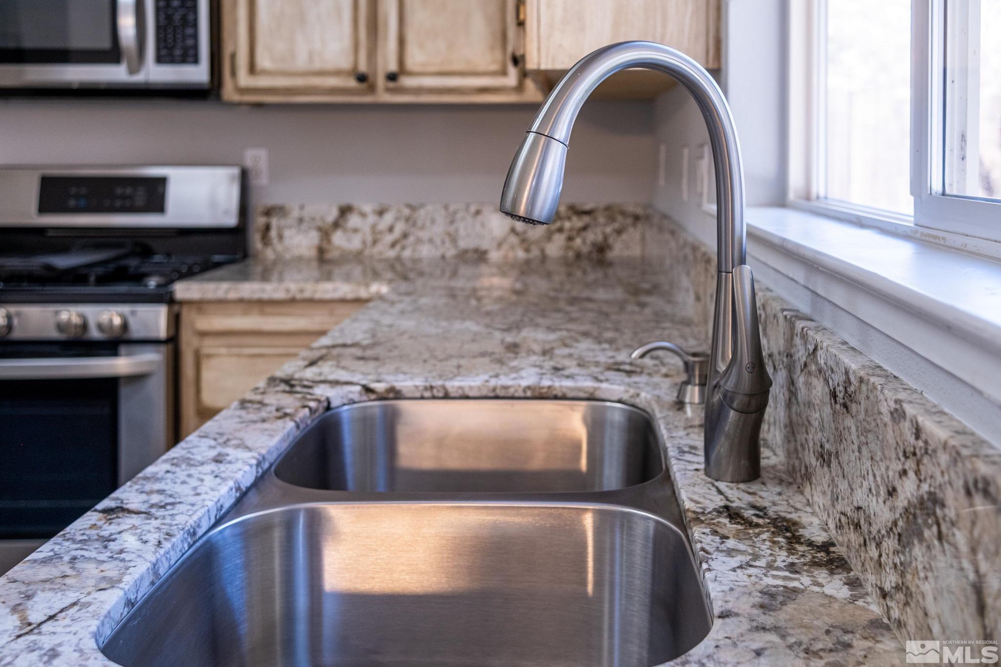 9430 Oakley Lane Reno, NV 89521 - Photo 12 of 28 a close view of a sink a faucet and appliance in the kitchen