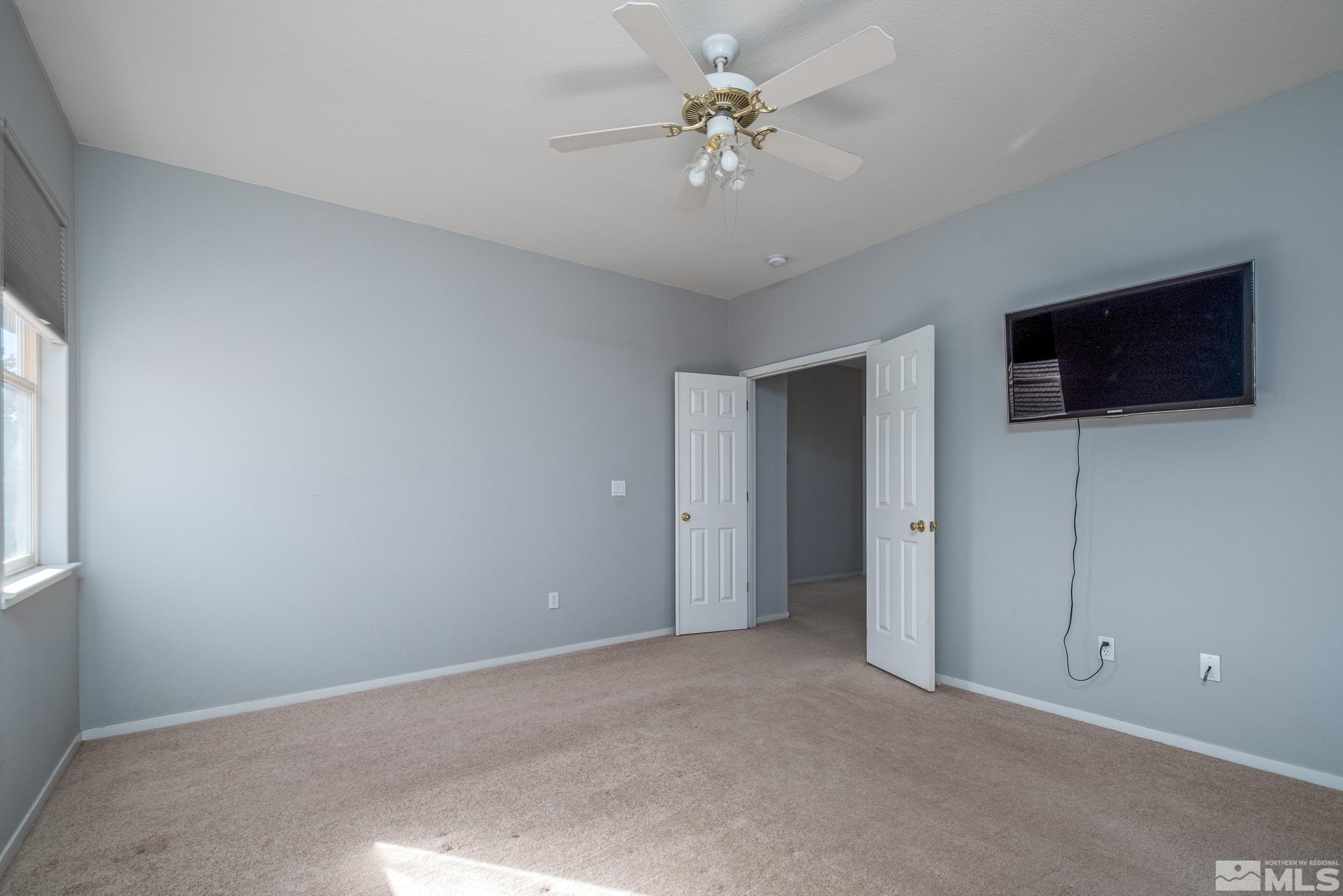 9430 Oakley Lane Reno, NV 89521 - Photo 18 of 28 a view of a livingroom with a flat screen tv