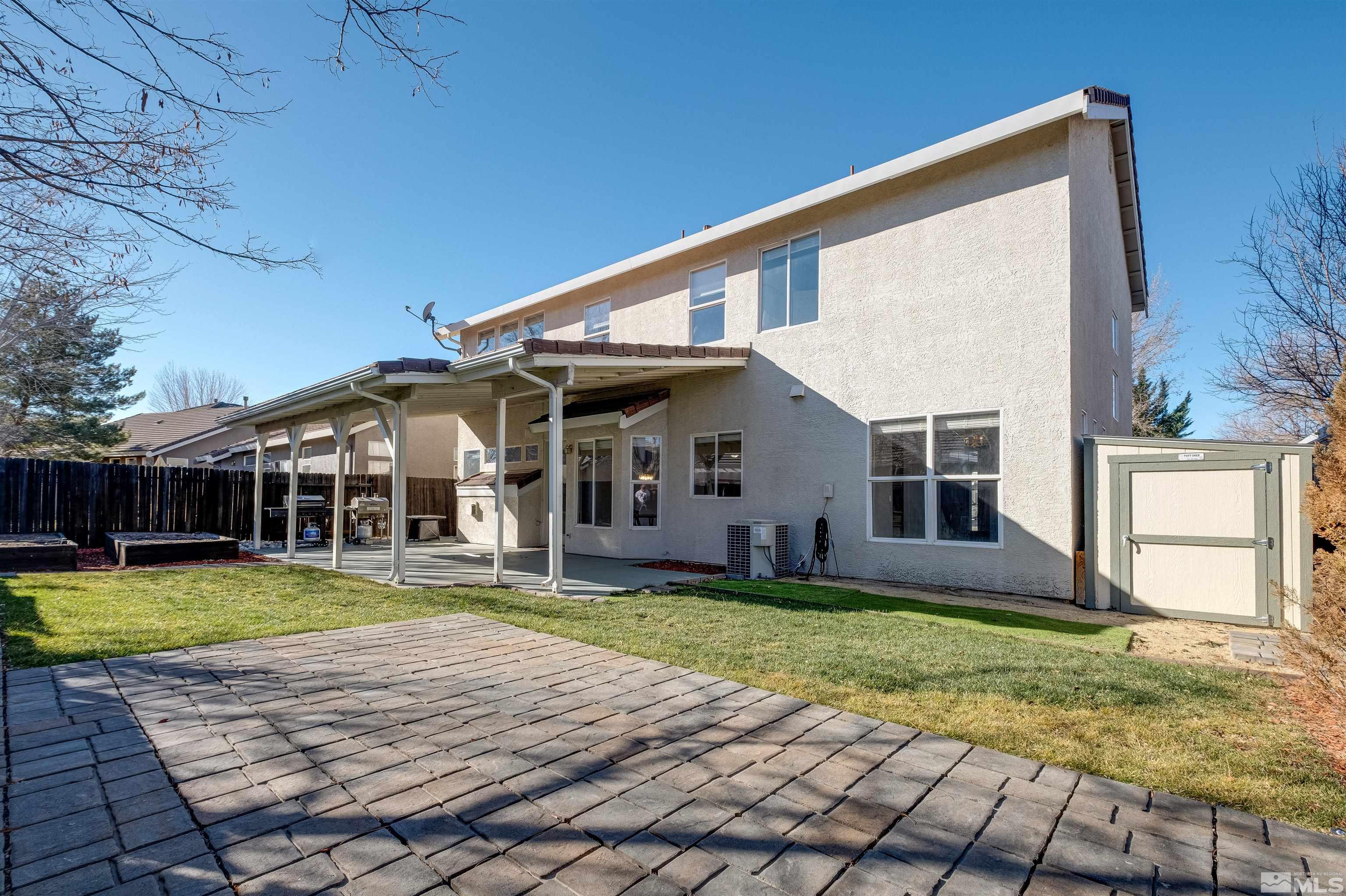 9430 Oakley Lane Reno, NV 89521 - Photo 2 of 28 front view of a house with a yard