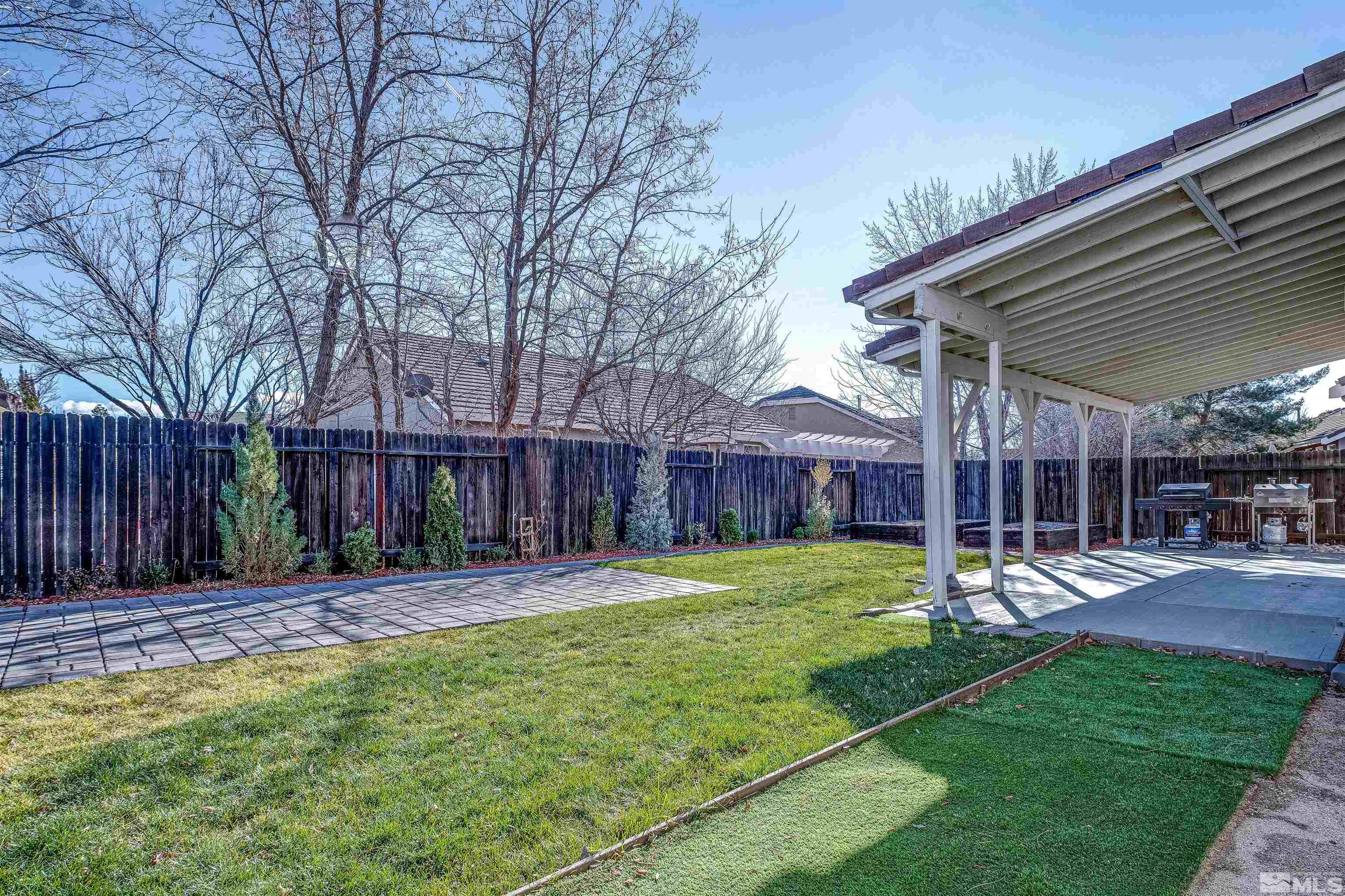 9430 Oakley Lane Reno, NV 89521 - Photo 26 of 28 a backyard of a house with table and chairs