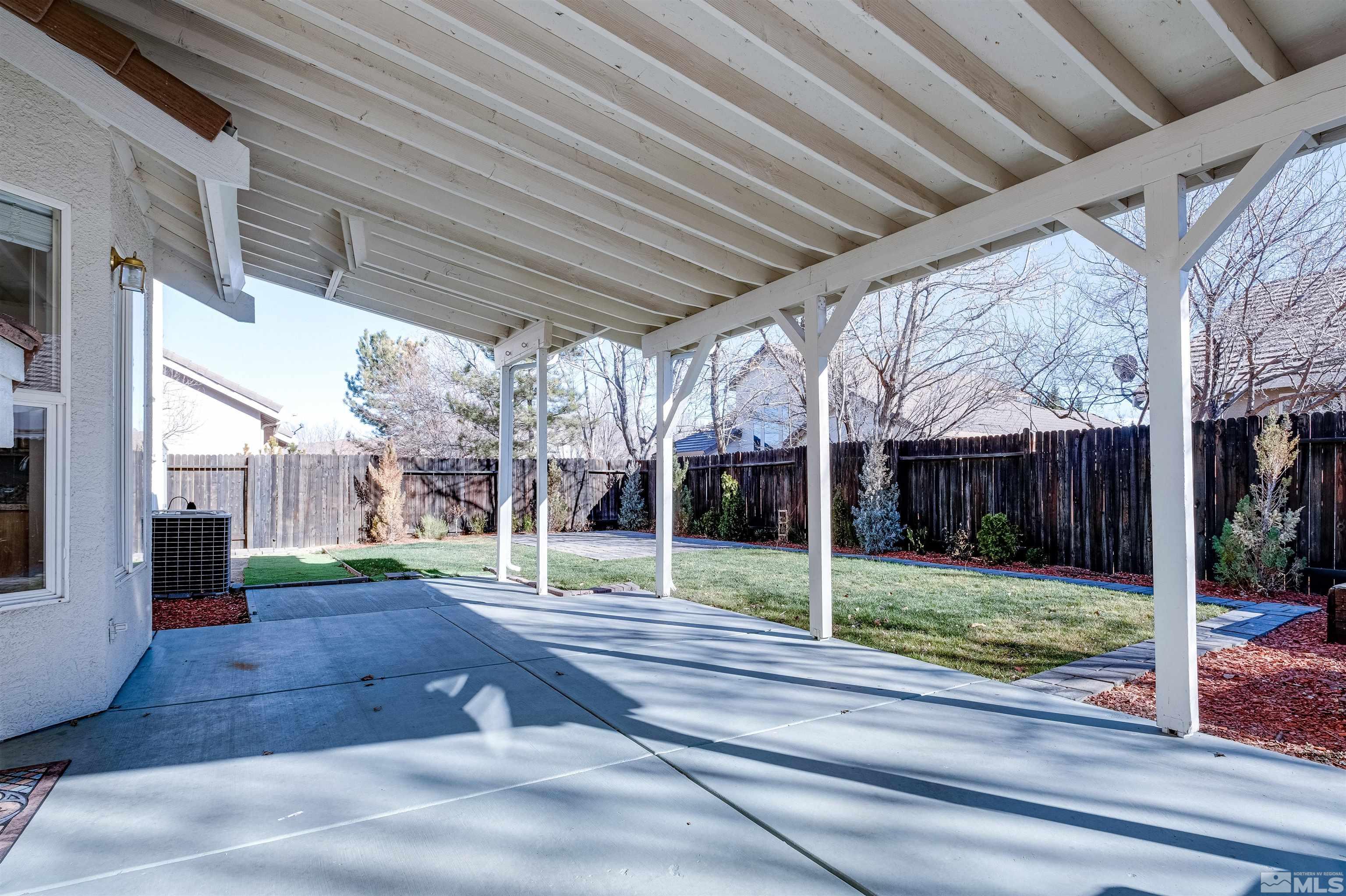 9430 Oakley Lane Reno, NV 89521 - Photo 27 of 28 a view of a patio with wooden fence