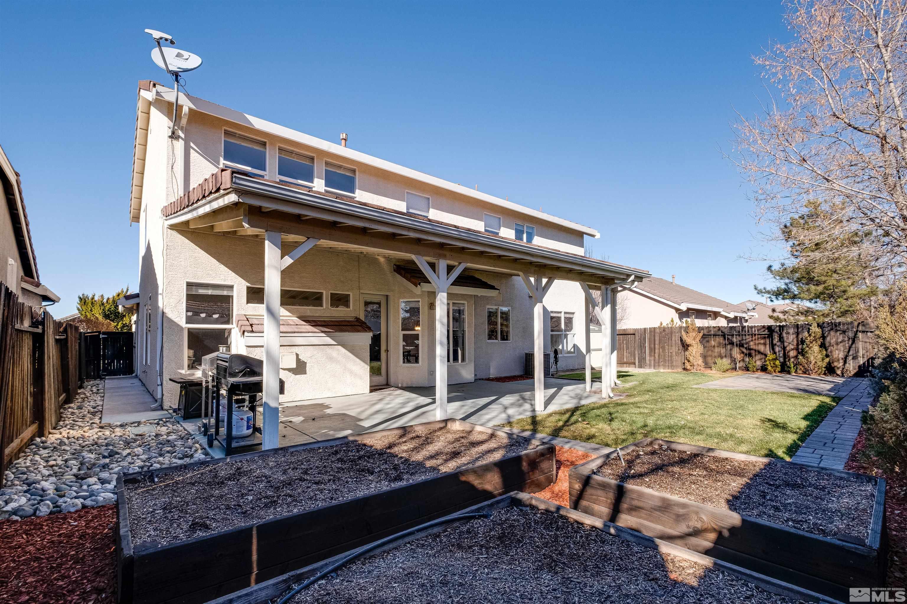 9430 Oakley Lane Reno, NV 89521 - Photo 28 of 28 a front view of a house with garden