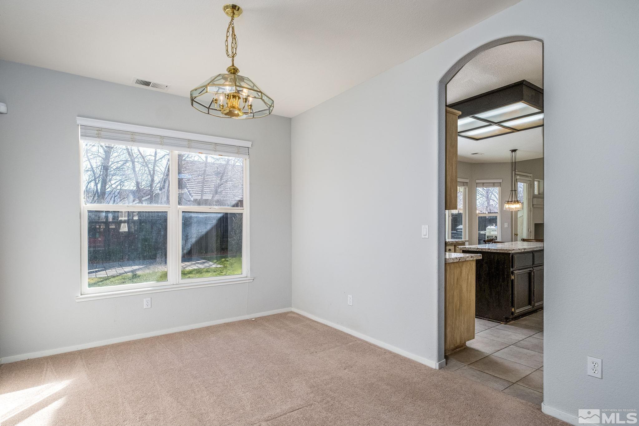 9430 Oakley Lane Reno, NV 89521 - Photo 7 of 28 an empty room with windows and entrance