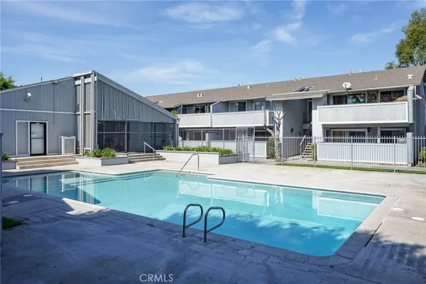 a view of a swimming pool with a lounge chairs