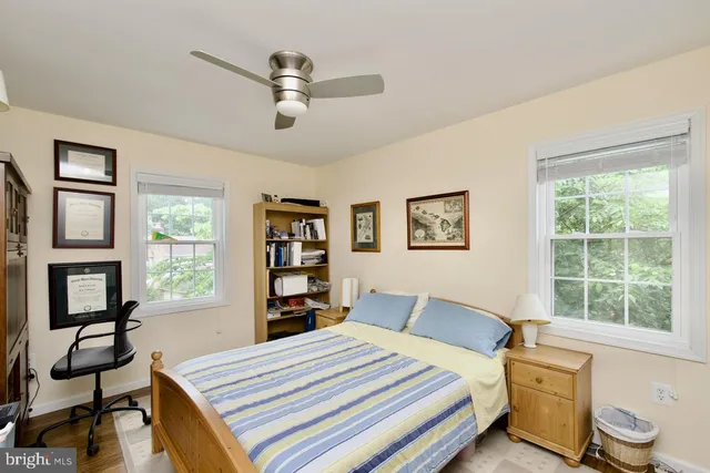 a bedroom with a bed furniture and a window