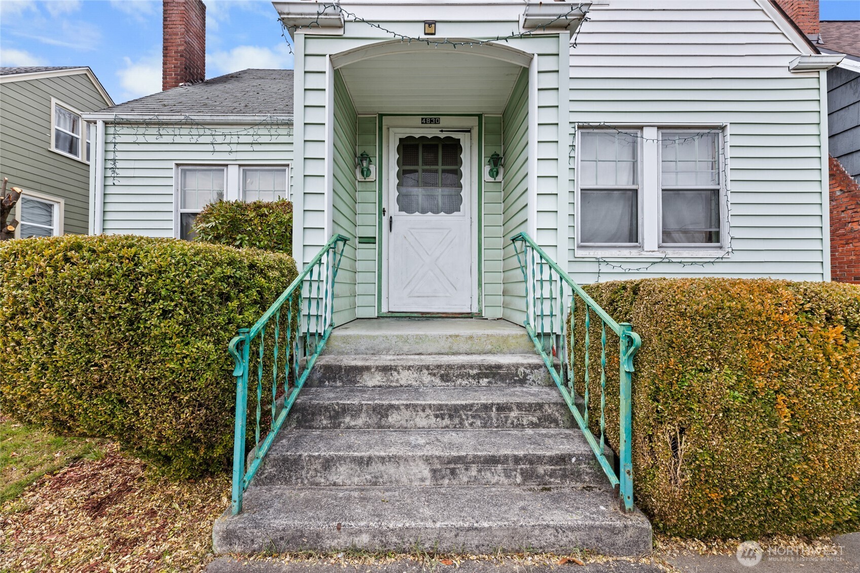 4830 South C Street Tacoma, WA 98408 - Photo 2 of 22 a view of a house with wooden fence