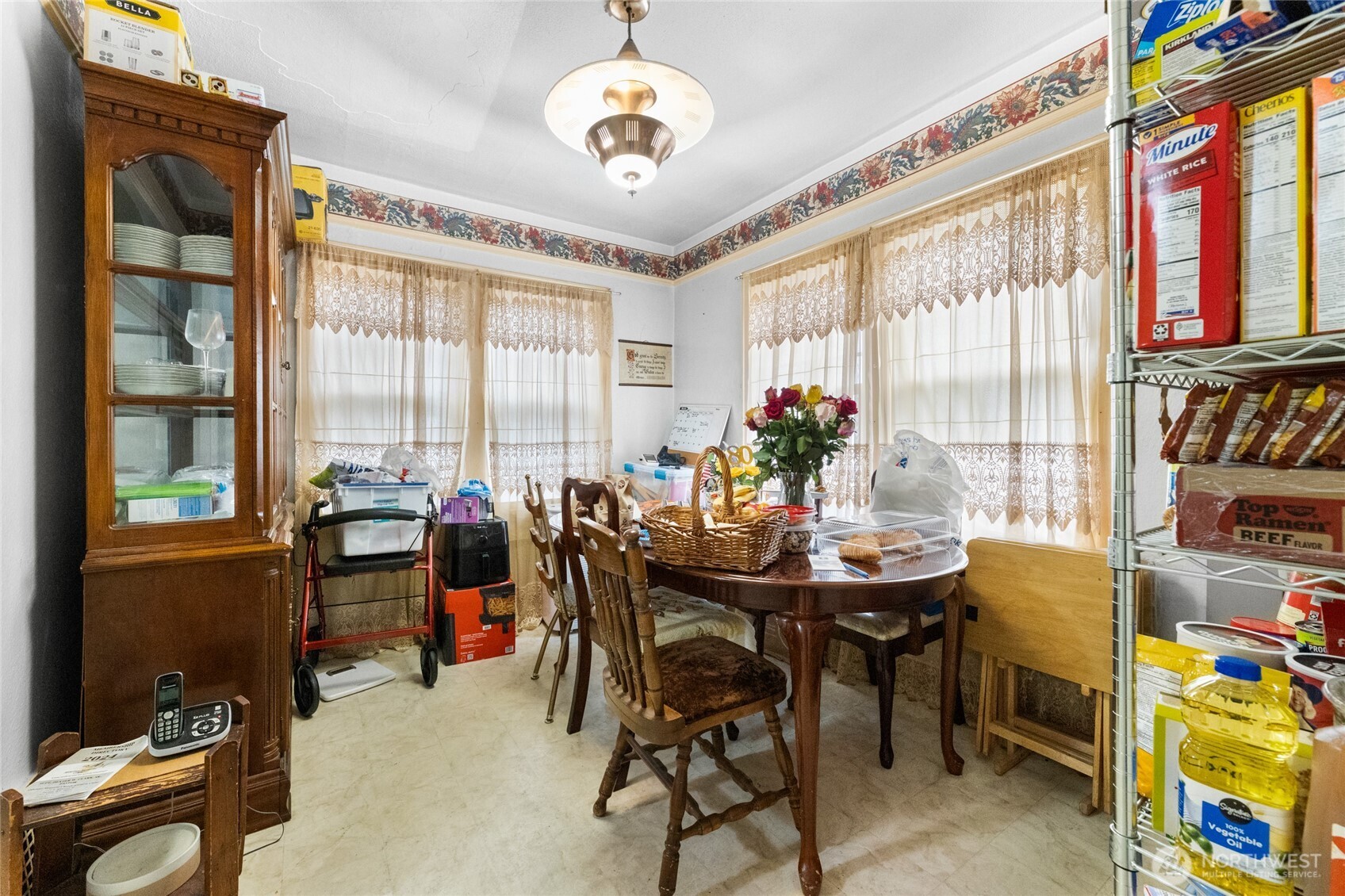 4830 South C Street Tacoma, WA 98408 - Photo 7 of 22 a view of a dining room with furniture and a chandelier