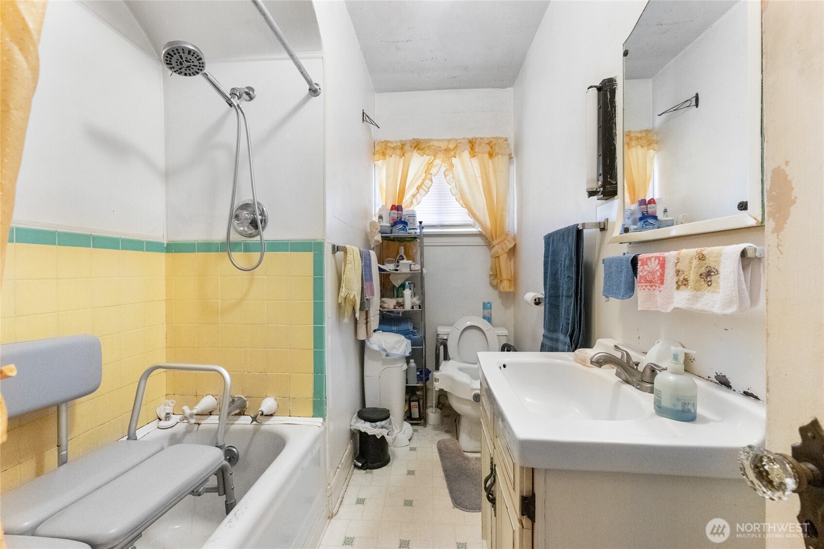 4830 South C Street Tacoma, WA 98408 - Photo 10 of 22 a bathroom with a sink mirror and a bathtub