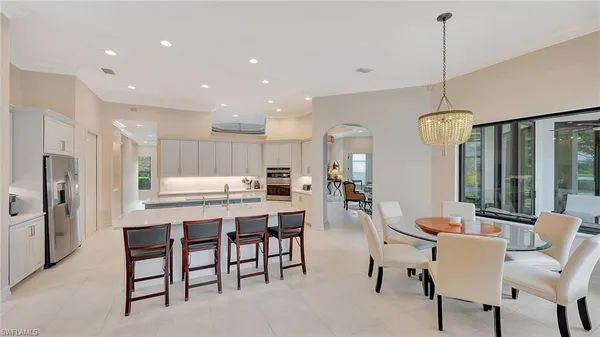 a dining room with furniture and window