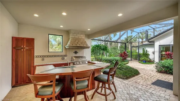 a view of a swimming pool with a patio and a garden