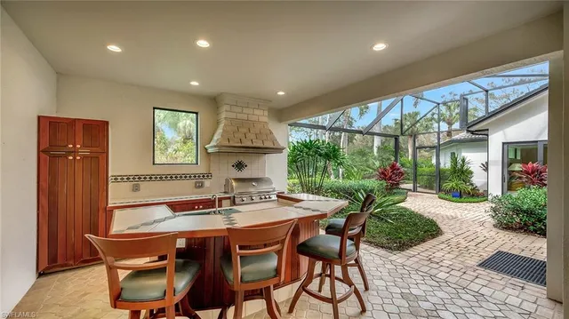 a view of a swimming pool with a patio and a garden