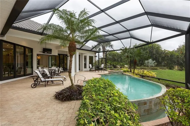 a kitchen with a table chairs and window