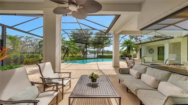 a patio with a yard table and chairs