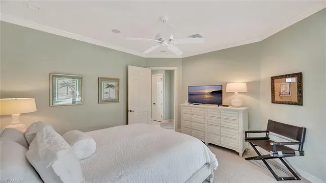 a bedroom with a bed and a chair