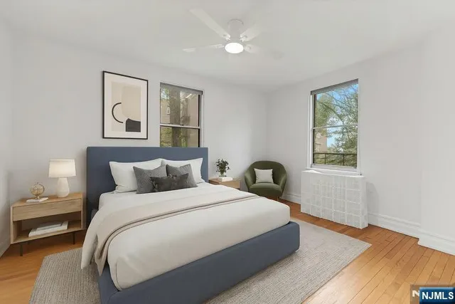 a bedroom with a large bed and a window