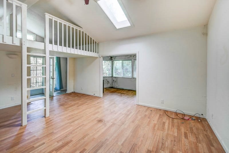 6388 Puupilo Road, Unit 2 Kapaa, HI 96746 - Photo 7 of 21 wooden floor in an empty room with a window