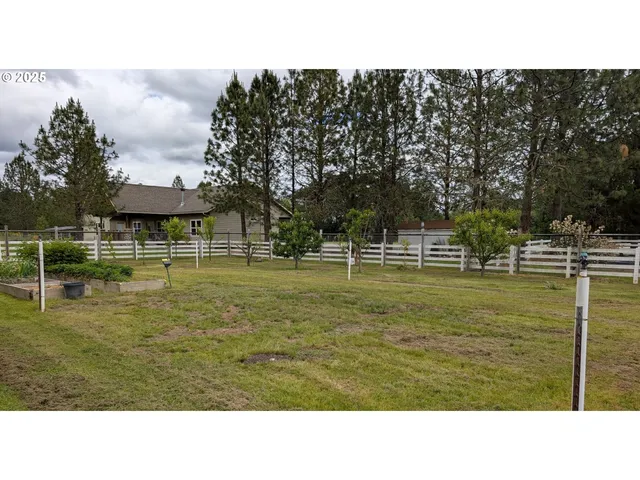a view of a park with swings and slides