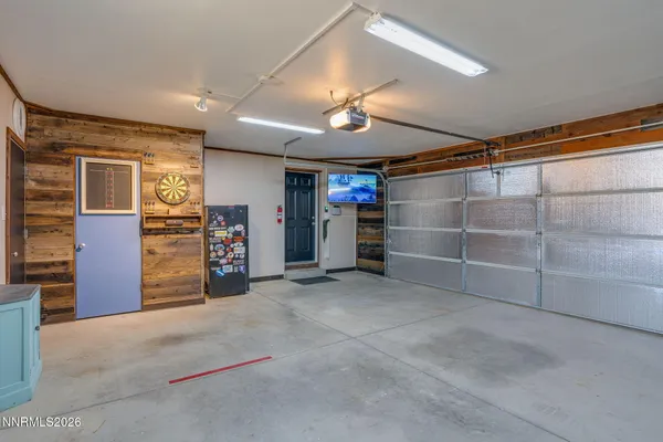 a view of a dry field with mountains in the background