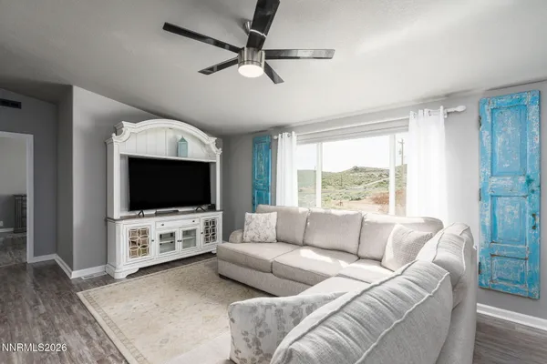 a view of a dining room with furniture window and wooden floor