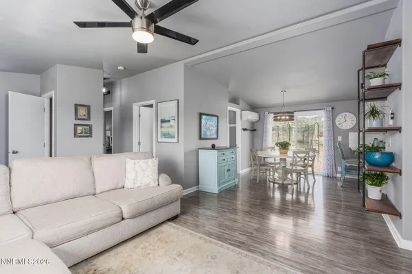 a kitchen with stainless steel appliances granite countertop a refrigerator a stove top oven a sink and dishwasher