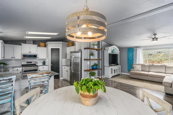 a view of a dining room with furniture window and outside view