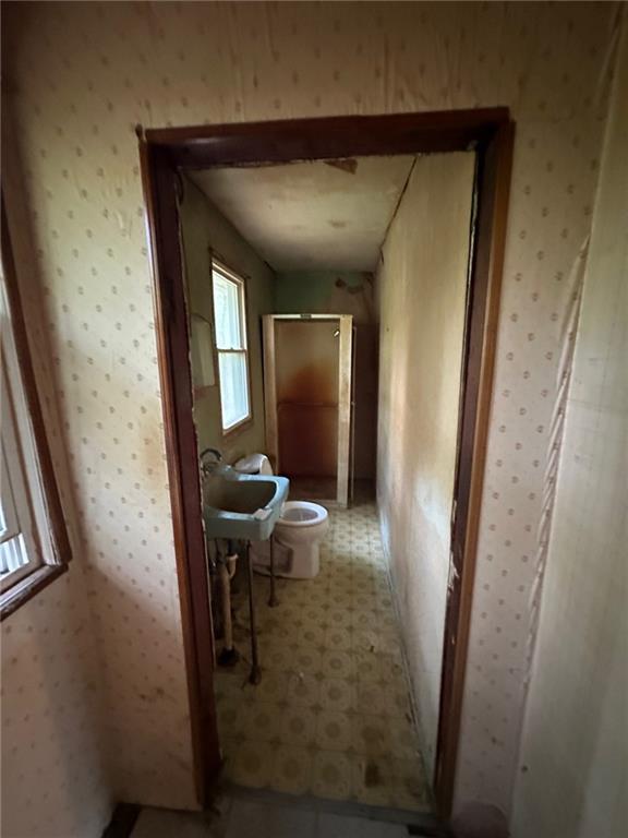 61 Mc Millan Road Mercer, PA 16137 - Photo 13 of 16 a view of a hallway and a livingroom with furniture