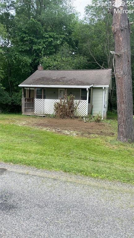 61 Mc Millan Road Mercer, PA 16137 - Photo 2 of 16 a front view of a house with a yard