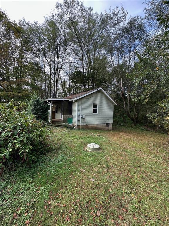 61 Mc Millan Road Mercer, PA 16137 - Photo 4 of 16 a view of house with backyard space and garden