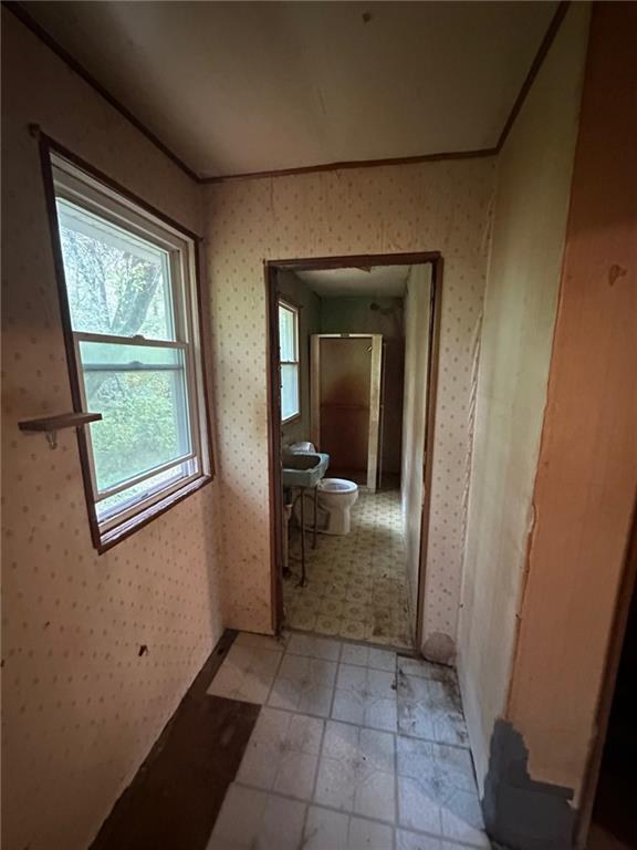 61 Mc Millan Road Mercer, PA 16137 - Photo 9 of 16 a view of a hallway and a livingroom with wooden floor and a hallway