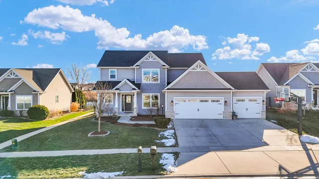 a view of a house with swimming pool and sitting area