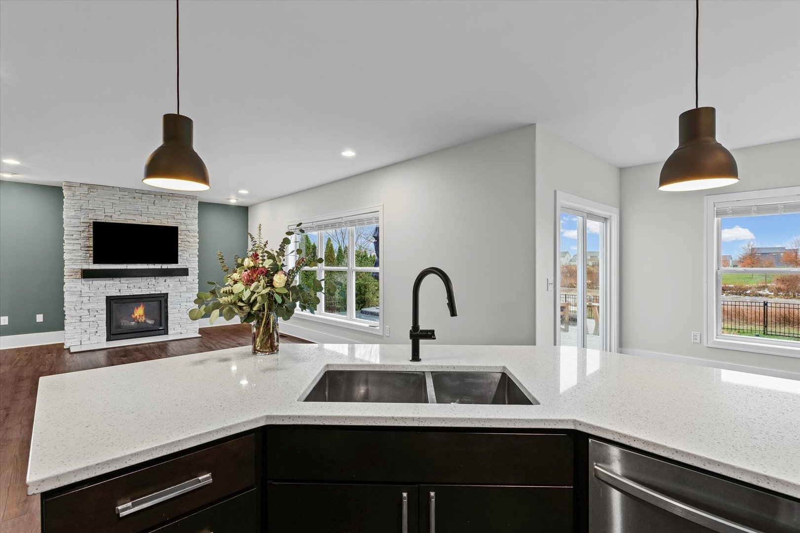 313 London Way Savoy, IL 61874 - Photo 23 of 85 a kitchen with a sink and a potted plant