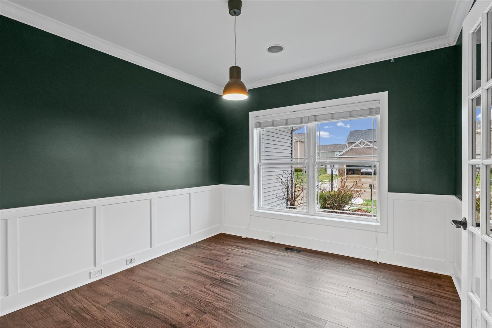 313 London Way Savoy, IL 61874 - Photo 29 of 85 a view of an empty room with wooden floor and a window