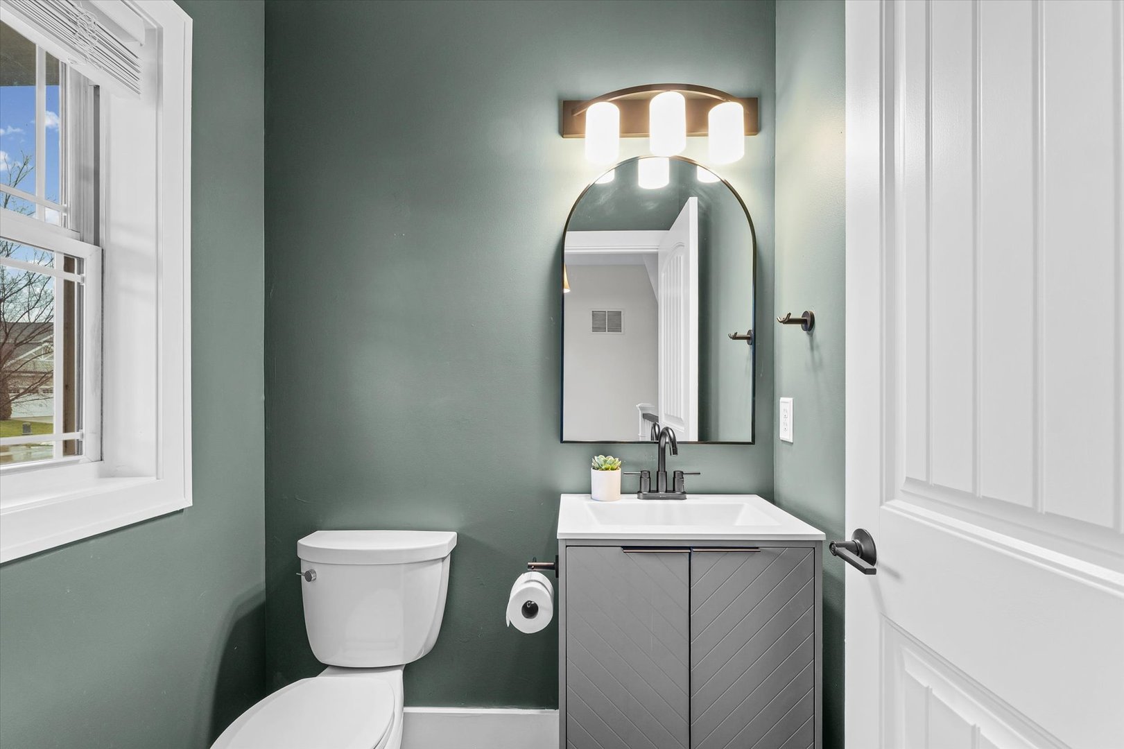 313 London Way Savoy, IL 61874 - Photo 31 of 85 a bathroom with a toilet sink and mirror