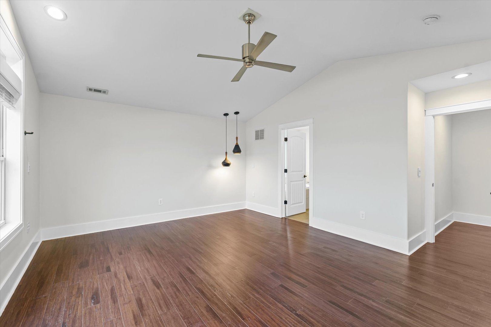 313 London Way Savoy, IL 61874 - Photo 42 of 85 an empty room with wooden floor window and ceiling fan