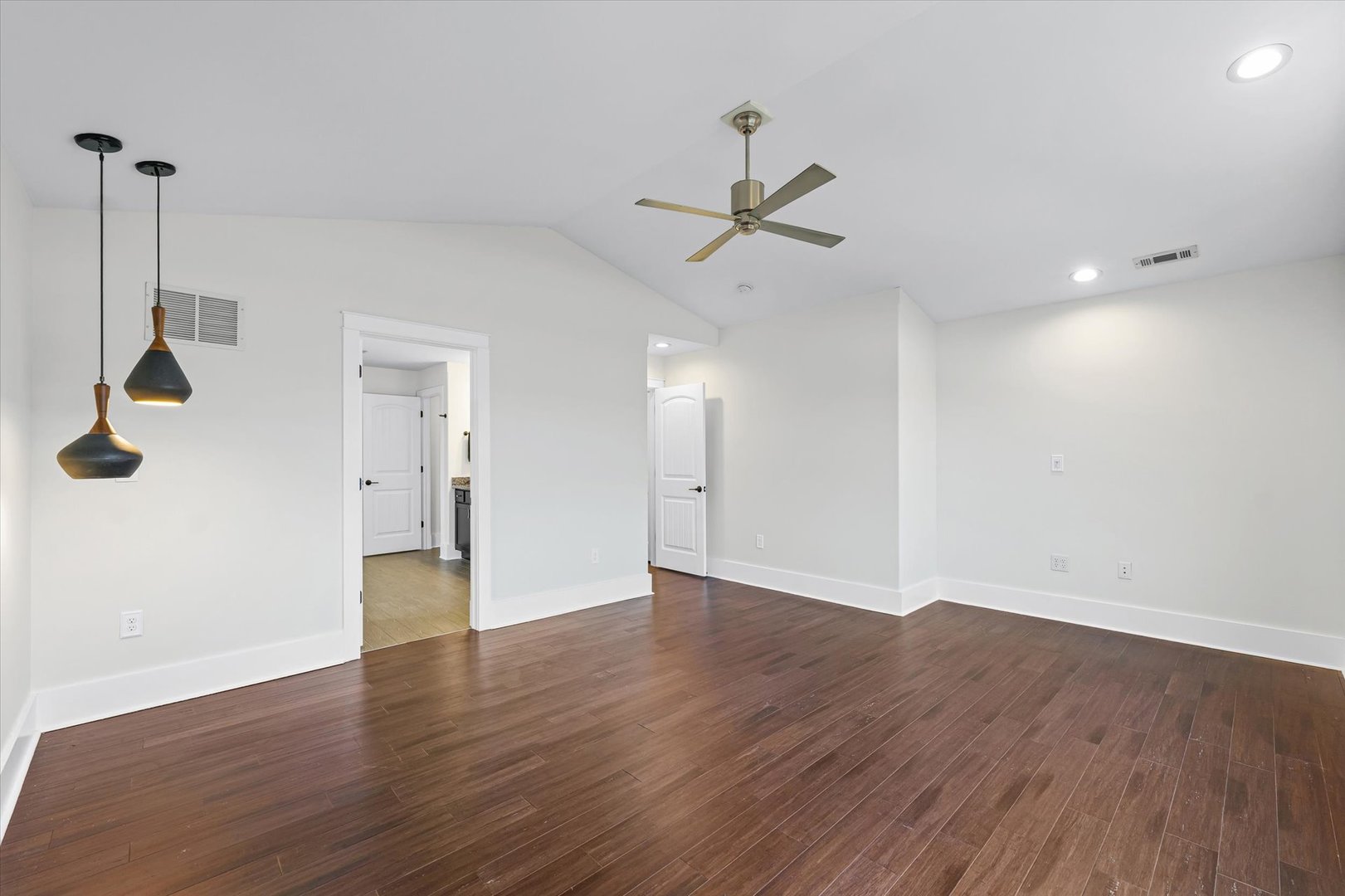 313 London Way Savoy, IL 61874 - Photo 43 of 85 a view of an empty room with wooden floor and a ceiling fan