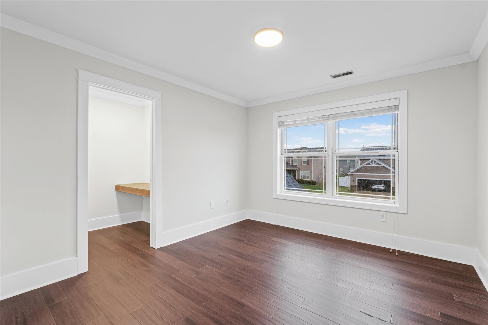 313 London Way Savoy, IL 61874 - Photo 50 of 85 an empty room with wooden floor and windows