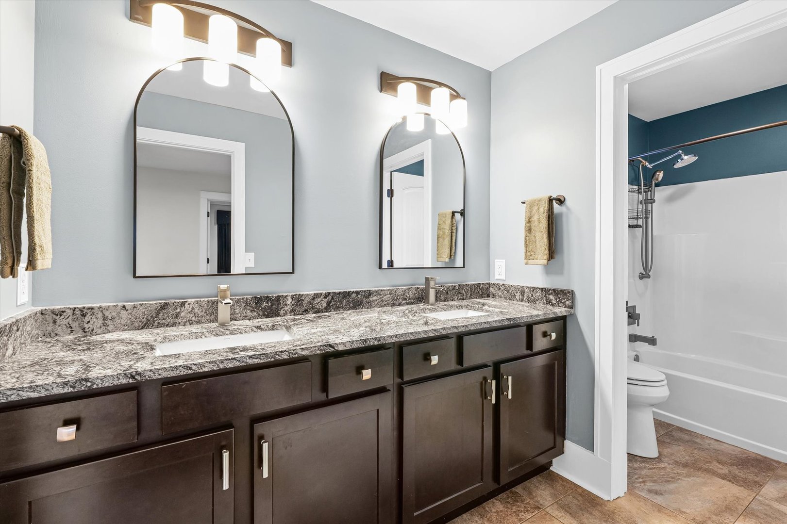 313 London Way Savoy, IL 61874 - Photo 52 of 85 a bathroom with a double vanity sink and a mirror