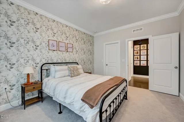 a bathroom with a sink vanity mirror and toilet