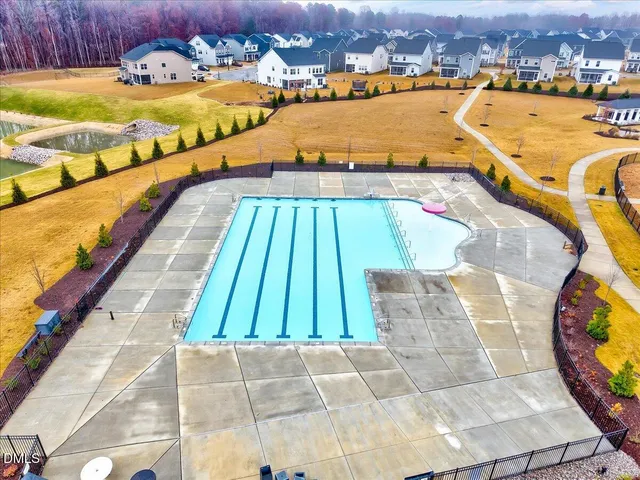 a view of a swimming pool and an outdoor space