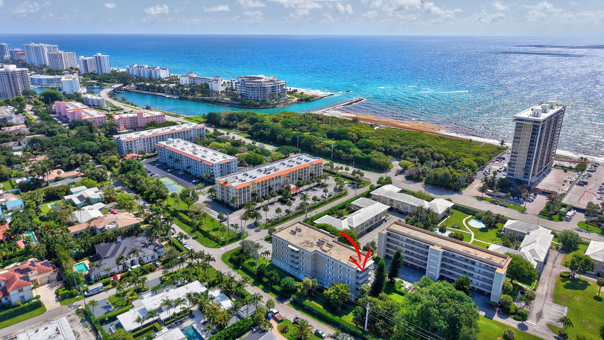 950 De Soto Road, Unit 5A Boca Raton, FL 33432 - Photo 1 of 98 an aerial view of residential houses with outdoor space and swimming pool