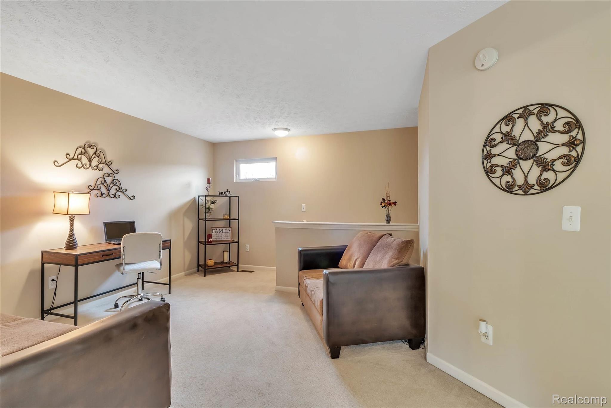 484 Hosta Howell, MI 48843 - Photo 5 of 33 You will LOVE this open and airy loft space on the upper level!