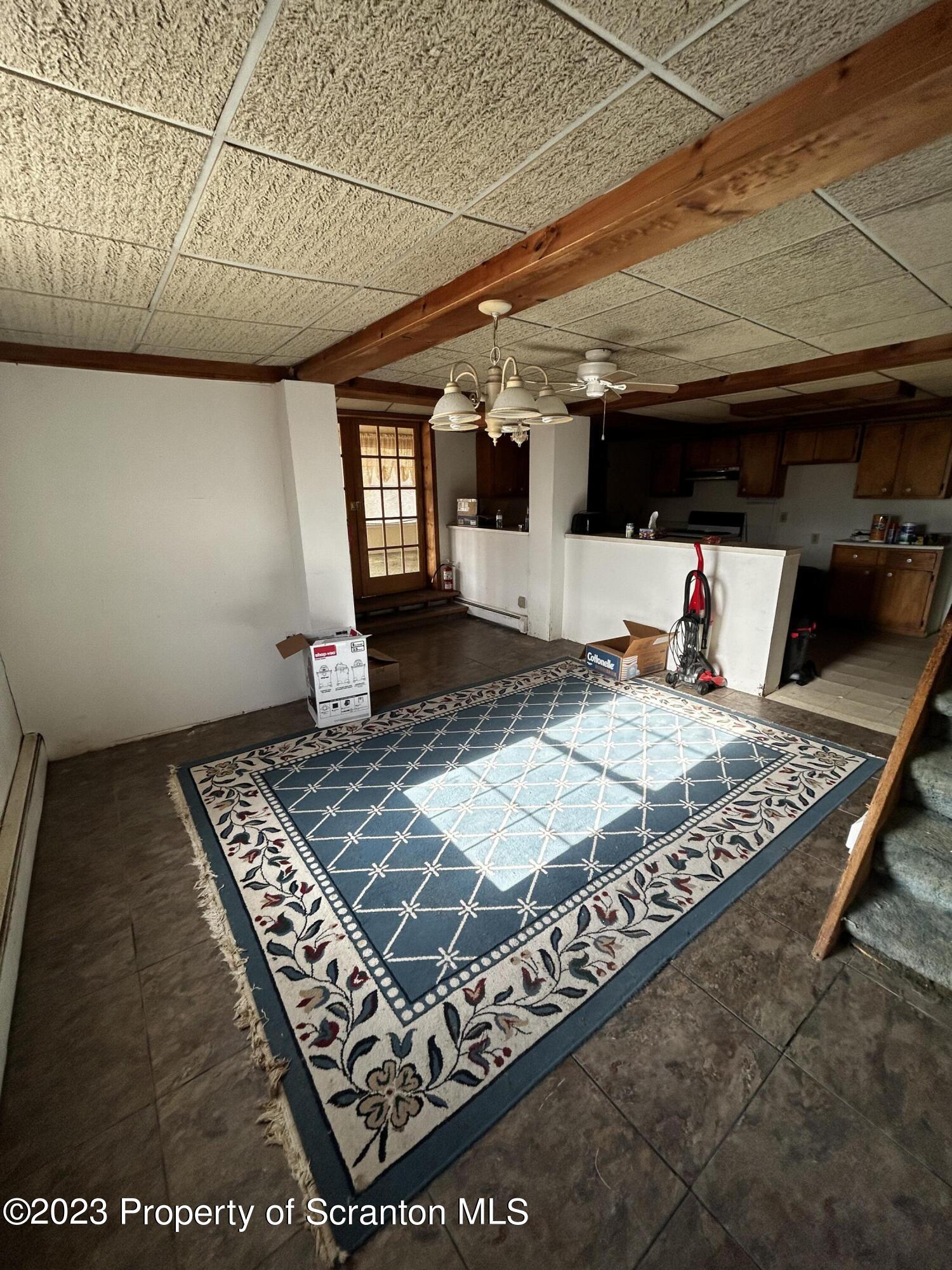 794 Coxton Road Duryea, PA 18642 - Photo 11 of 24 a bed sitting in a room next to a window