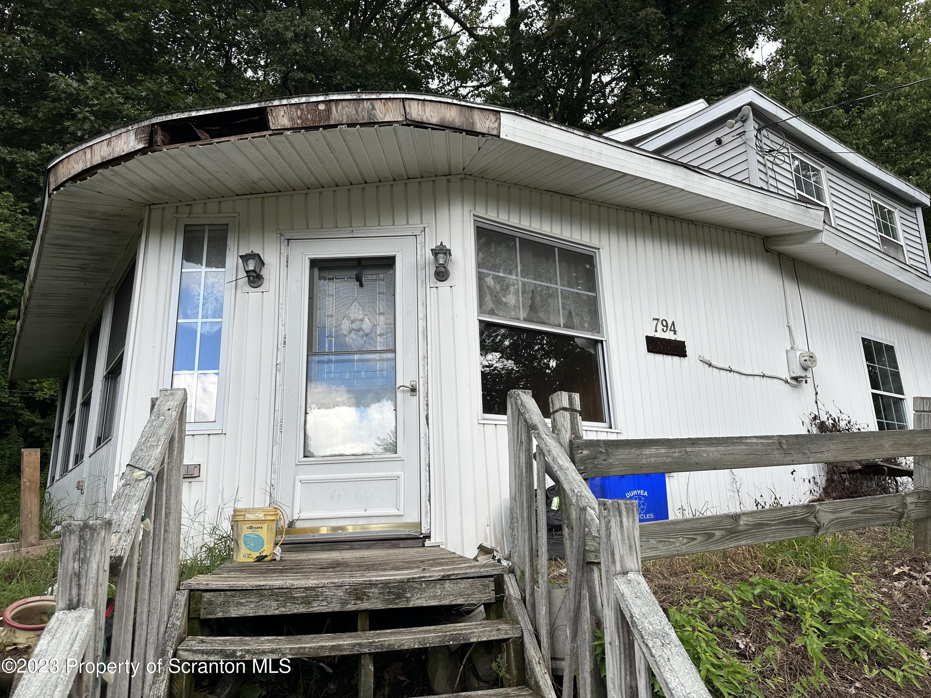 794 Coxton Road Duryea, PA 18642 - Photo 2 of 24 a front view of a house with large windows