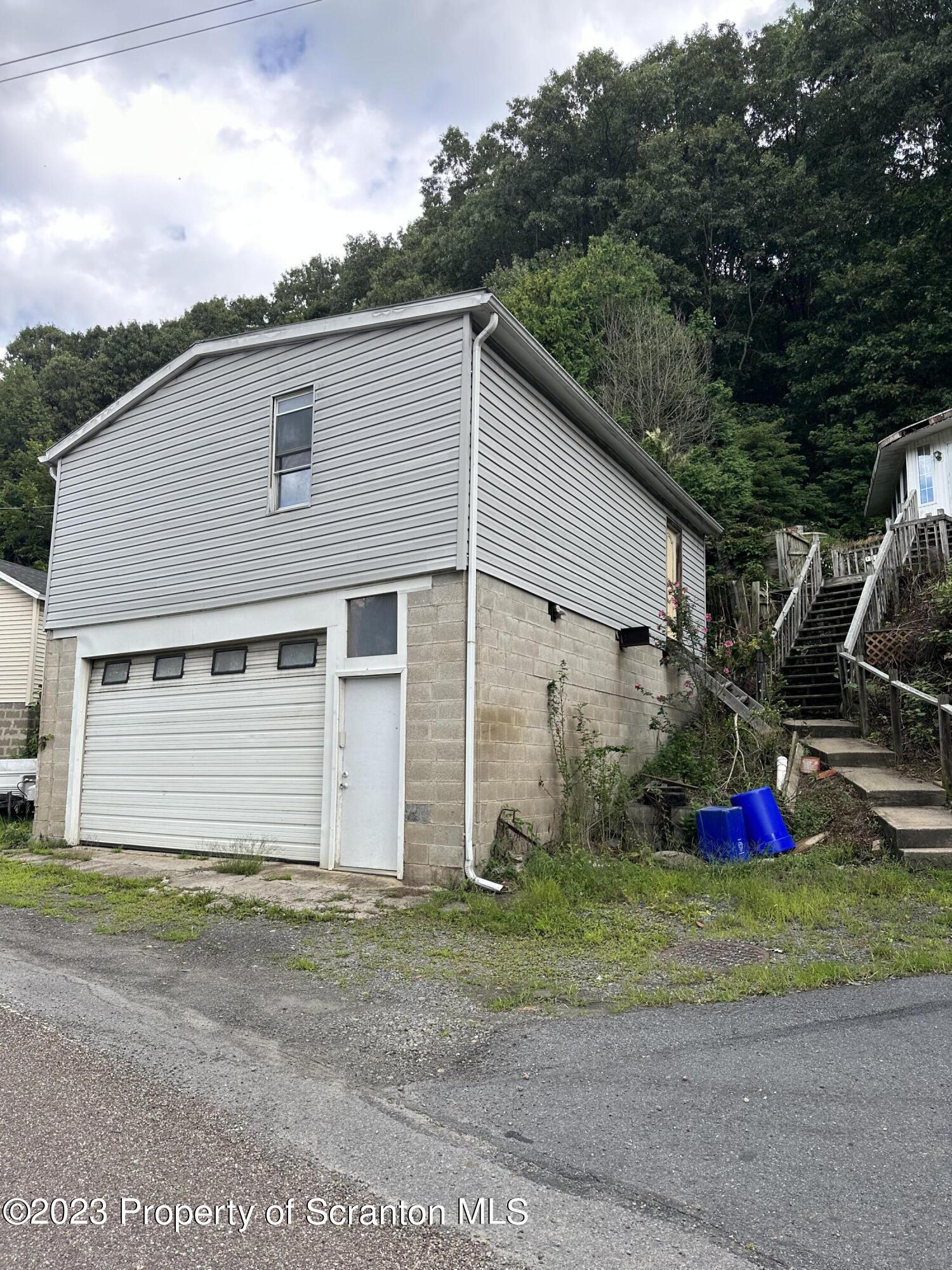 794 Coxton Road Duryea, PA 18642 - Photo 4 of 24 a view of a house with a yard