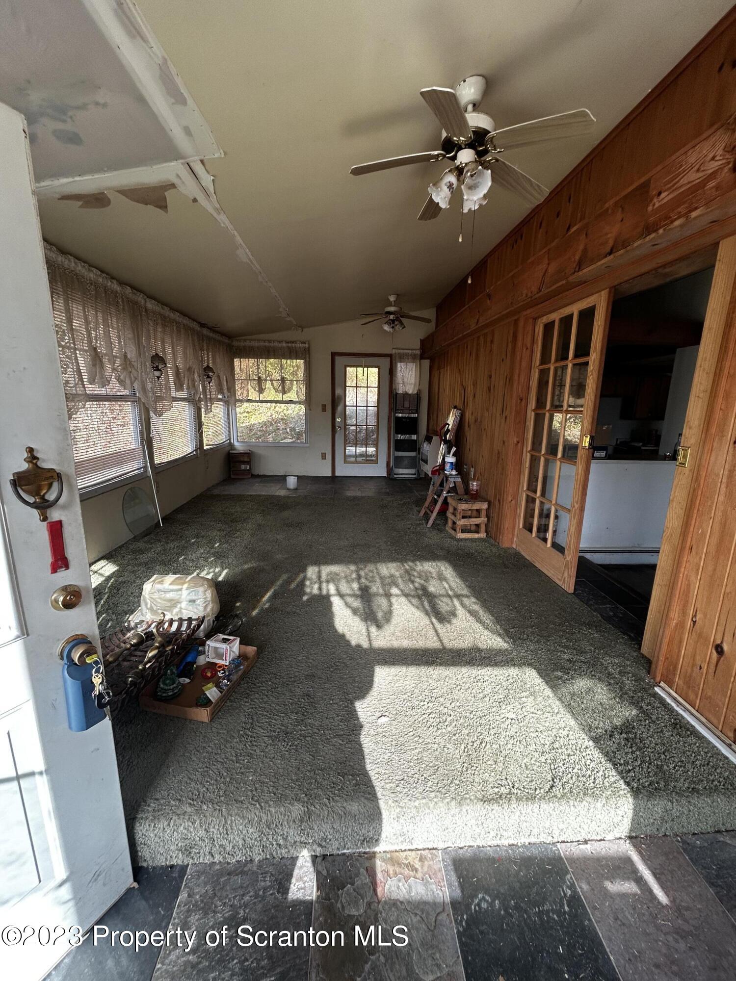 794 Coxton Road Duryea, PA 18642 - Photo 5 of 24 a room with lots of furniture and a rug