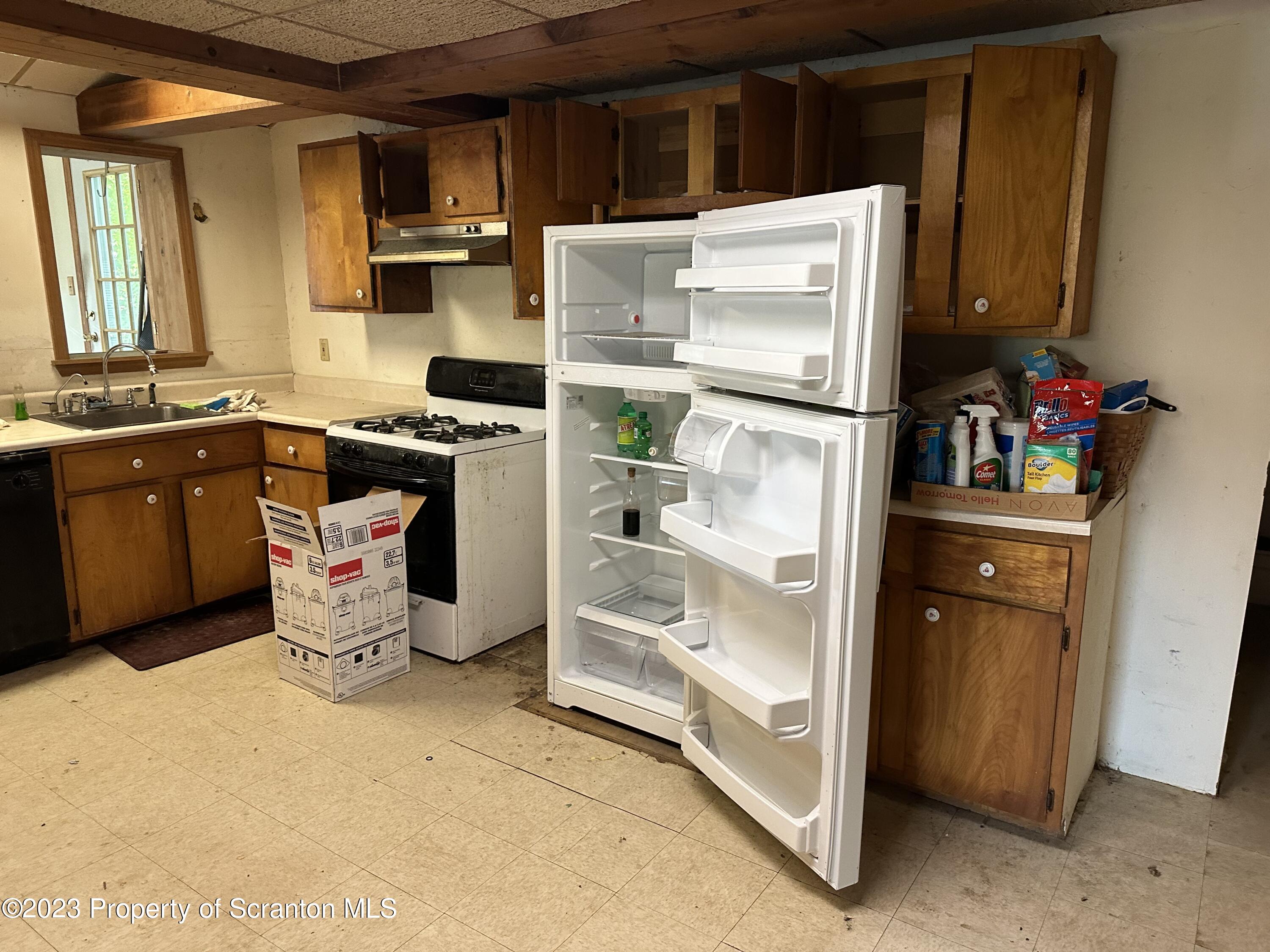 794 Coxton Road Duryea, PA 18642 - Photo 8 of 24 a kitchen with stainless steel appliances a refrigerator sink and cabinets