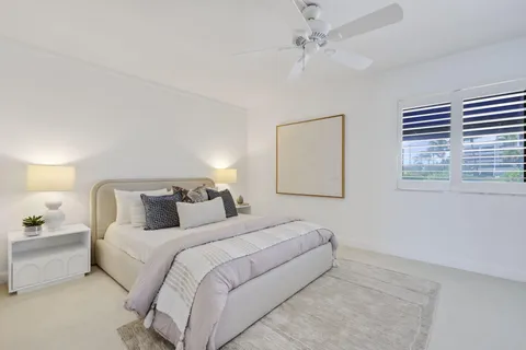 a bedroom with bed and a window