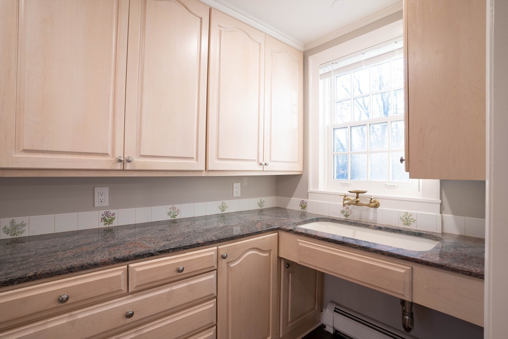 40 Puddingstone Lane Newton, MA 02459 - Photo 11 of 32 a kitchen with granite countertop white cabinets and a sink