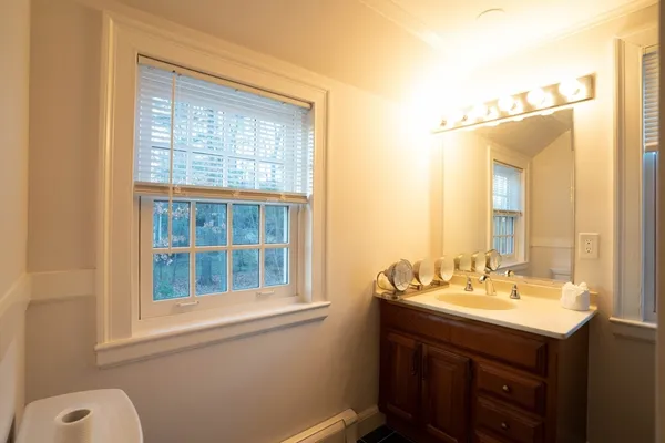 a bathroom with a bathtub sink and shower